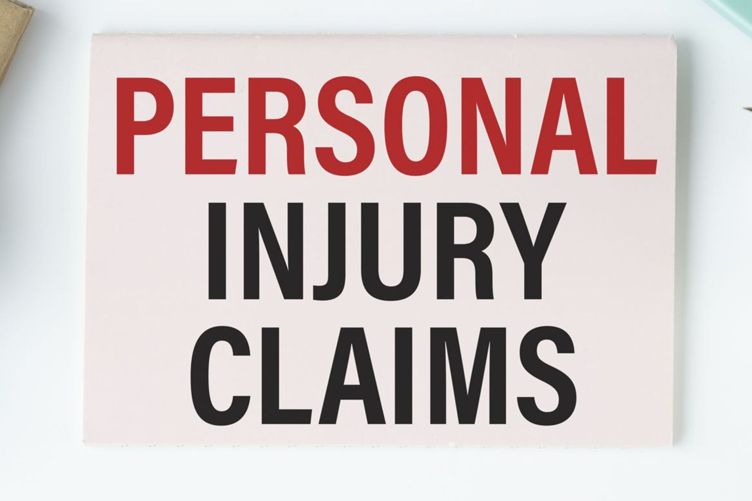 Should You Accept a Settlement Offer for a Car Accident Injury? 5 Hand reviewing a personal injury demand letter alongside medical records